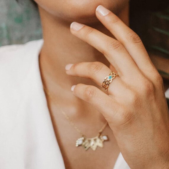 Bague fine de créateur, dorée et noire