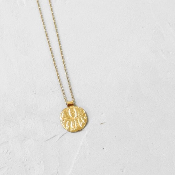 Collier gri-gri drama oeil portecteur