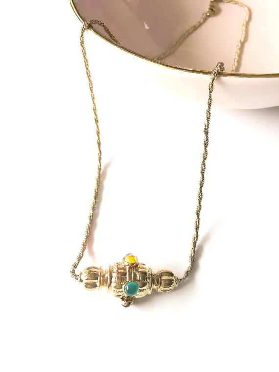 collier toupie moulin chez poisson plume bijoux