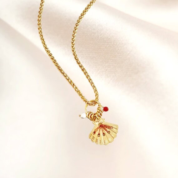 collier amulette cuivrée coquillage poisson plume