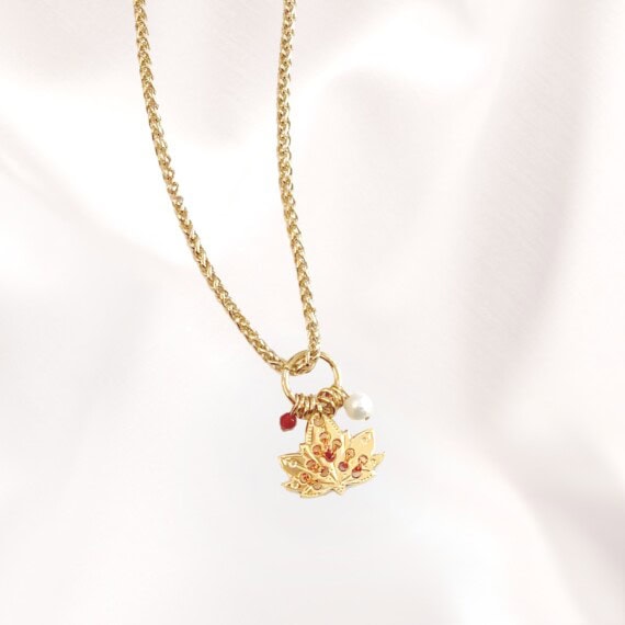 collier amulette cuivrée feuille de lotus poisson plume bjoux