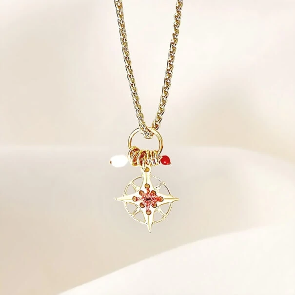 collier amulette rose des vents cuivrée chez poissonplume bijoux