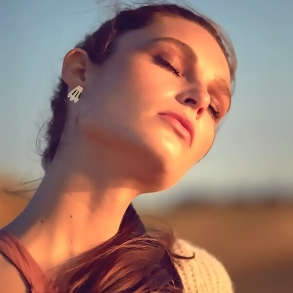 Puces d'oreilles plumes canopée femme