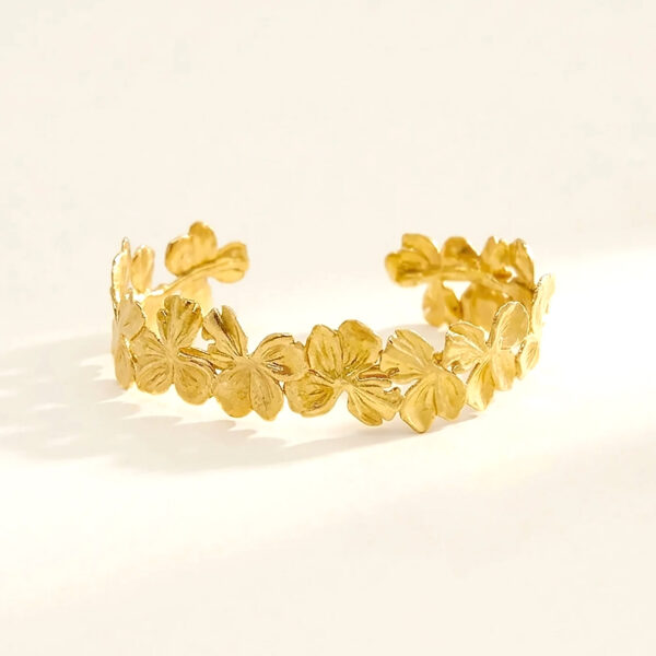 Bracelet fleurs antikyra - Jonc ouvert ajustable doré - modèle femme pour petit poignet.